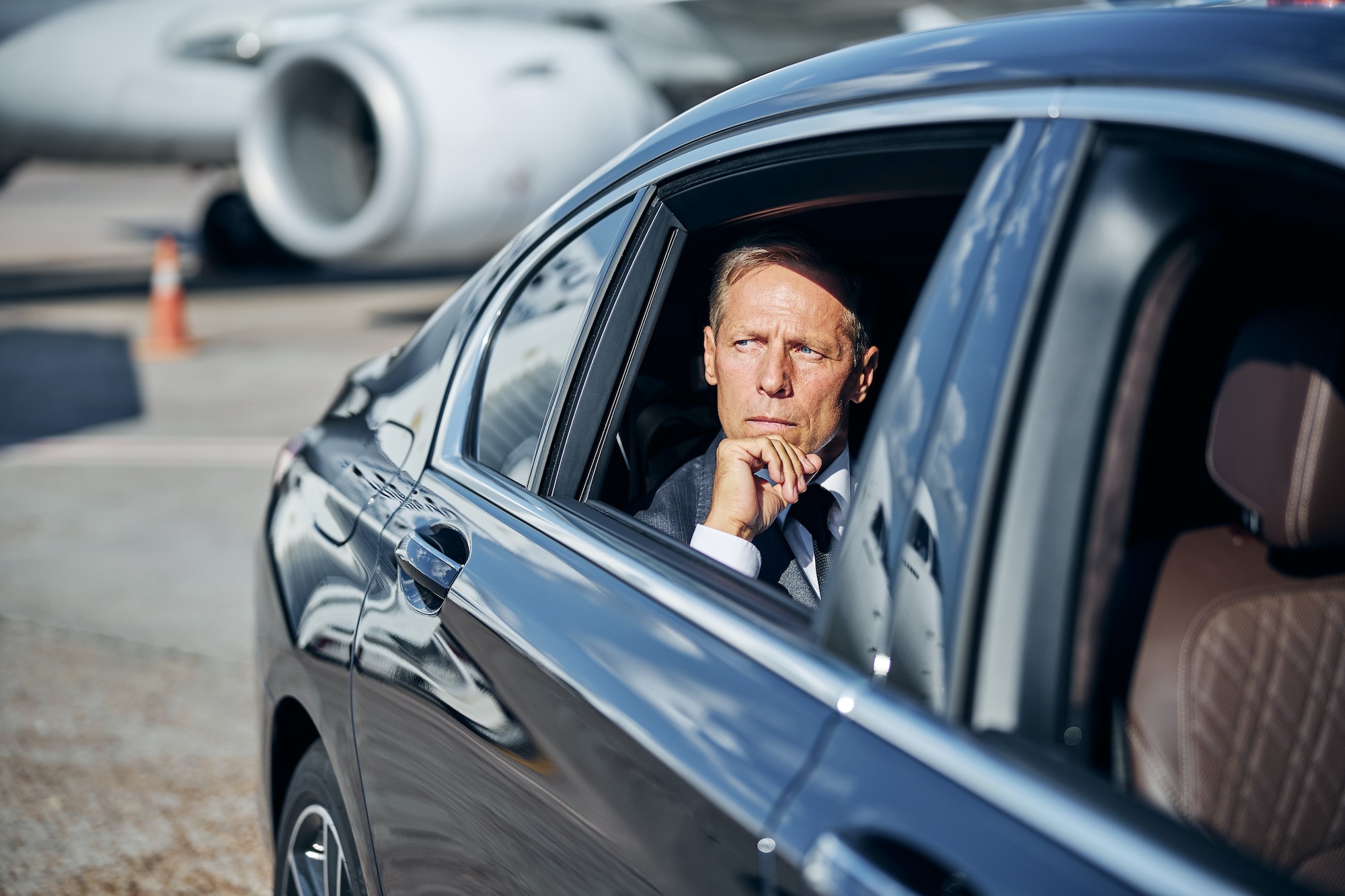 Mature elegant man during transfer after landing